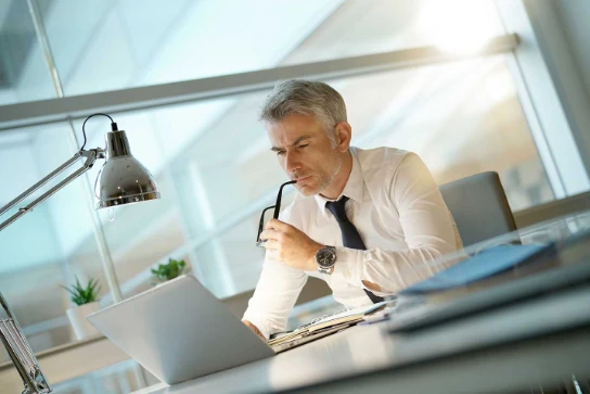 business person using laptop